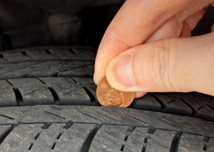 Checking tire tread depth and wear with a penny. If you can see all of Lincoln's head, your tread depth is less than 1/16th of an inch and it's time to replace your tires. Checking tire tread depth and wear with a penny. If you can see all of Lincoln's head, your tread depth is less than 1/16th of an inch and it's time to replace your tires.