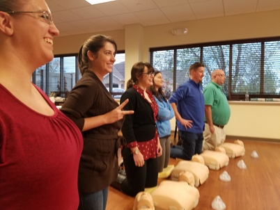 Metzger Wickersham staff learning CPR.