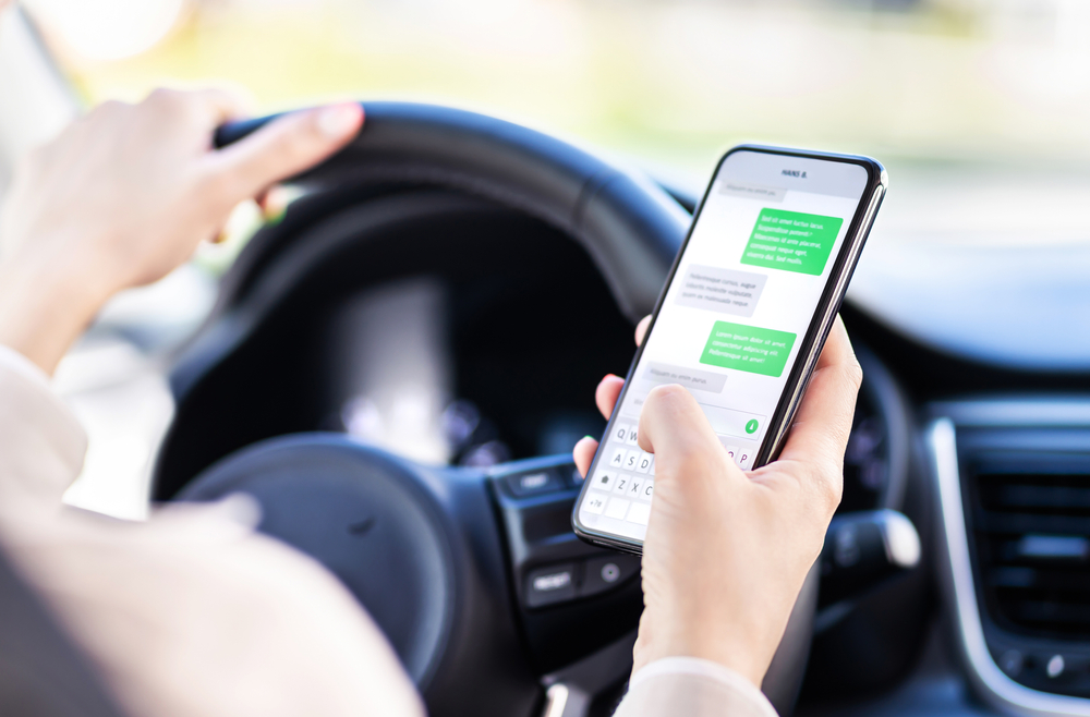 Driving,Car,And,Using,Phone.,Distracted,Driver,Texting,With,Mobile