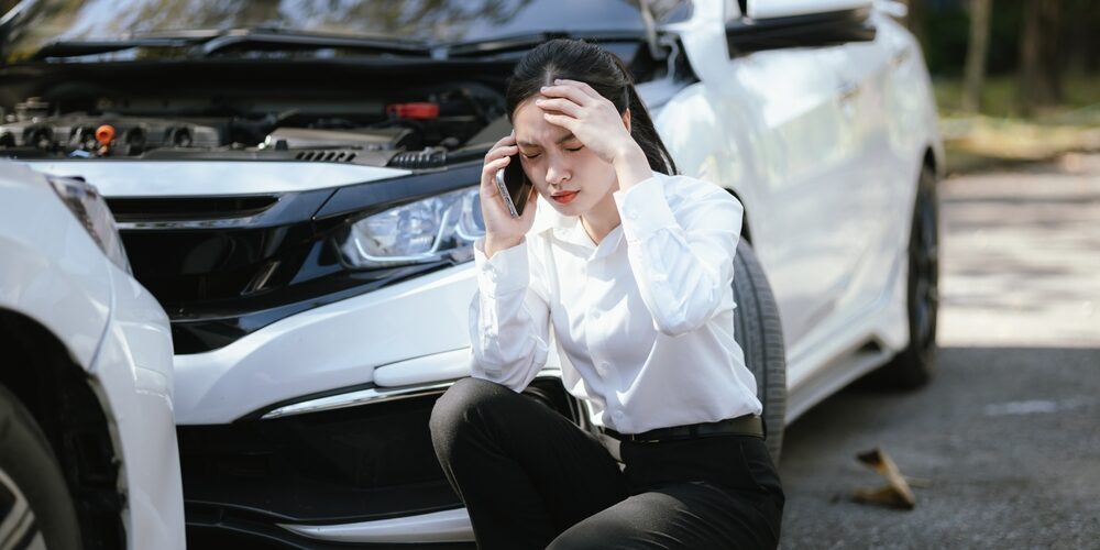 Asian,Woman,Calls,Insurance,Company,For,Help,After,Car,Accident pennsylvania car accident lawyer